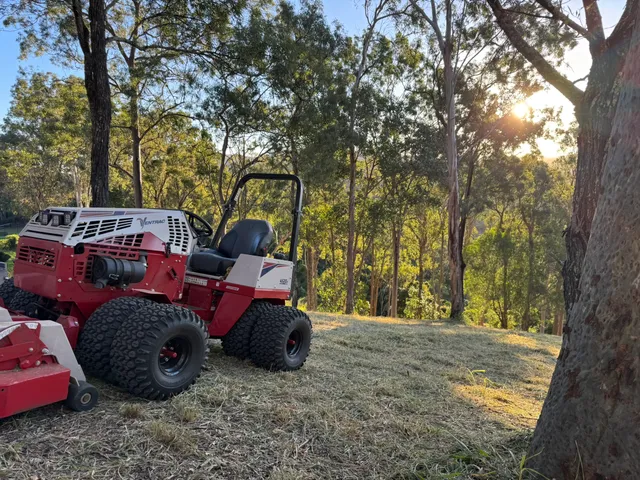 Ventrac 4520P articulated tractor with dual wheels, side-on, on a mowed acreage block