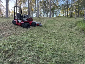 Ventrac 4520P slashing long grass on the banks of a farm dam