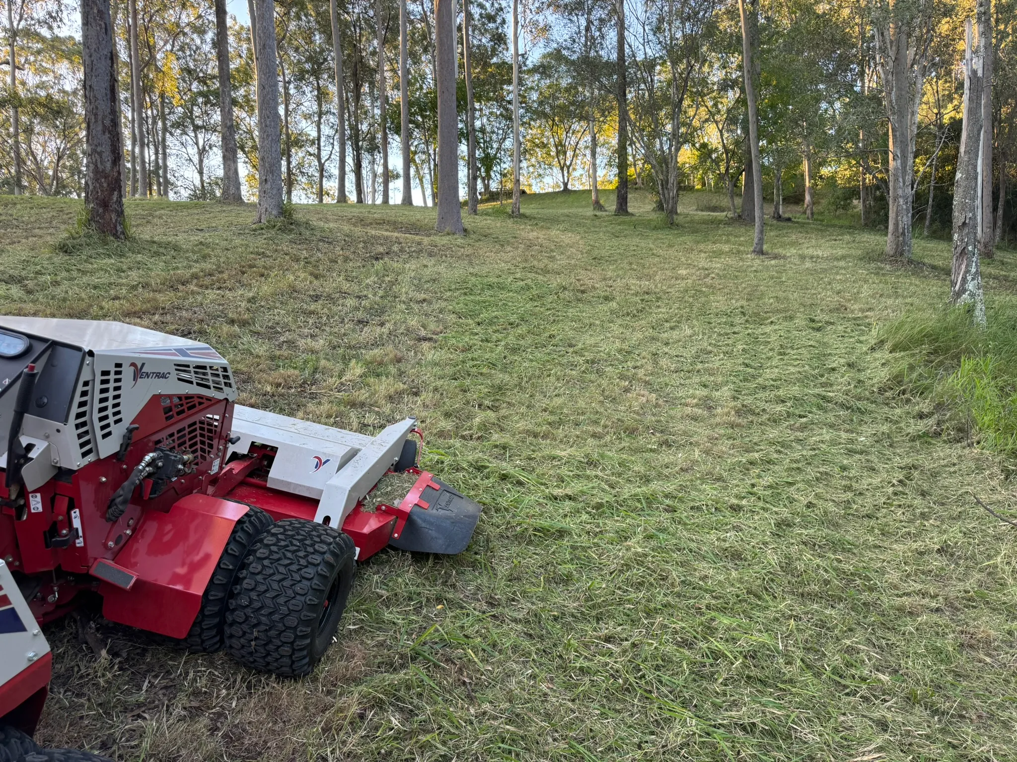 Ventrac 4520P slashing tall grass beside a farm dam